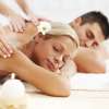 Beautiful couple enjoying in the back massage.